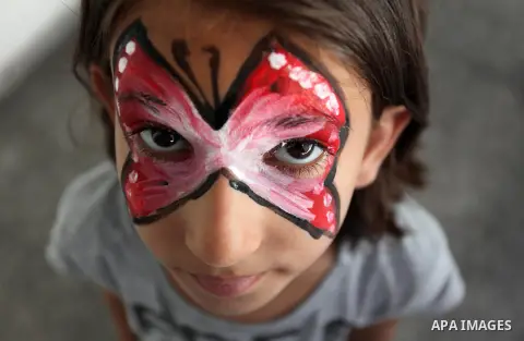 Palestinian schoolgirls enjoy as part of the activities proposed during a summer camp organised by the United Nations on July 25, 2016 in Gaza City. Photo by Ashraf Amra