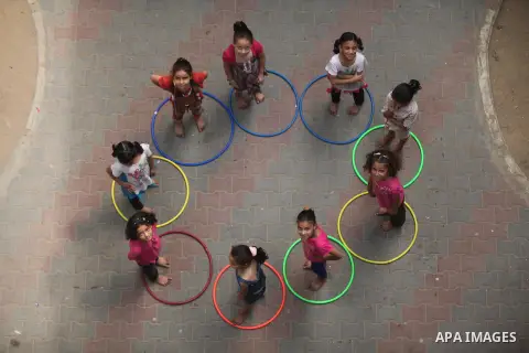 Palestinian schoolgirls enjoy as part of the activities proposed during a summer camp organised by the United Nations on July 25, 2016 in Gaza City. Photo by Ashraf Amra