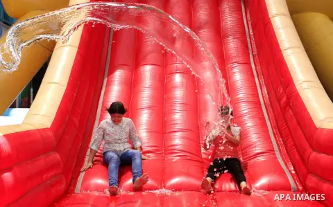 Palestinian schoolgirls enjoy as part of the activities proposed during a summer camp organised by the United Nations on July 25, 2016 in Gaza City. Photo by Ashraf Amra