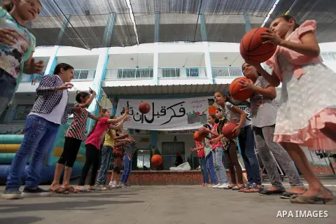 Palestinian schoolgirls enjoy as part of the activities proposed during a summer camp organised by the United Nations on July 25, 2016 in Gaza City. Photo by Ashraf Amra