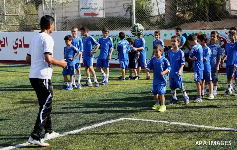 Palestinian boys take part in a training season for football school at Al Jazeera club in Gaza city, on July 26, 2016. Photo by Mohammed Asad
