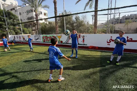 Palestinian boys take part in a training season for football school at Al Jazeera club in Gaza city, on July 26, 2016. Photo by Mohammed Asad