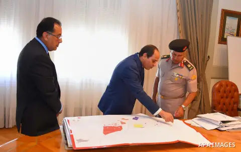 Egyptian President Abdel Fattah al-Sisi meets with Mostafa Madbouly Housing Minister and Kamel al-Wazeer a head of Engineering Authority in Cairo, Egypt, on July 26, 2016. Photo by Egyptian President Office