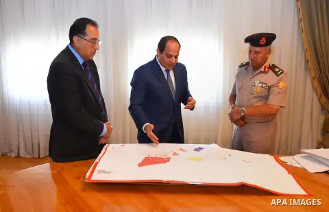 Egyptian President Abdel Fattah al-Sisi meets with Mostafa Madbouly Housing Minister and Kamel al-Wazeer a head of Engineering Authority in Cairo, Egypt, on July 26, 2016. Photo by Egyptian President Office