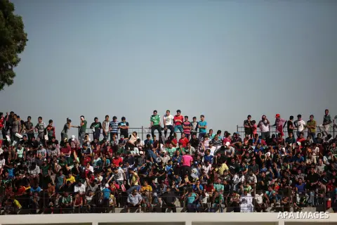 Palestinian spectators watch the first leg of the Palestine Cup final soccer match between Gaza Strip's Khan Younis Youth and Hebron's Al-Ahly at al-Yarmouk stadium in Gaza City July 26, 2016. Photo by Ashraf Amra
