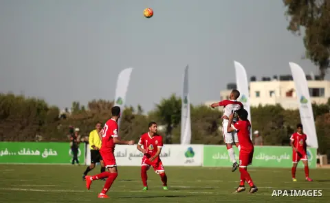 Palestinian Gaza Strip's Khan Younis Youth and Hebron's players compete during the first leg of the Palestine Cup final soccer match at al-Yarmouk stadium in Gaza City July 26, 2016. Photo by Ashraf Amra