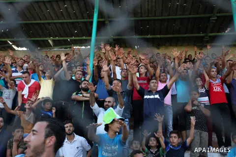 Palestinian spectators watch the first leg of the Palestine Cup final soccer match between Gaza Strip's Khan Younis Youth and Hebron's Al-Ahly at al-Yarmouk stadium in Gaza City July 26, 2016. Photo by Ashraf Amra