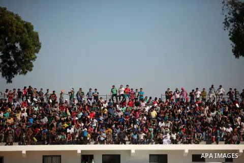 Palestinian spectators watch the first leg of the Palestine Cup final soccer match between Gaza Strip's Khan Younis Youth and Hebron's Al-Ahly at al-Yarmouk stadium in Gaza City July 26, 2016. Photo by Ashraf Amra
