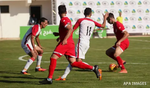 Palestinian Gaza Strip's Khan Younis Youth and Hebron's players compete during the first leg of the Palestine Cup final soccer match at al-Yarmouk stadium in Gaza City July 26, 2016. Photo by Ashraf Amra