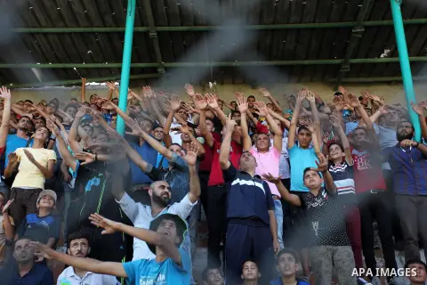 Palestinian spectators watch the first leg of the Palestine Cup final soccer match between Gaza Strip's Khan Younis Youth and Hebron's Al-Ahly at al-Yarmouk stadium in Gaza City July 26, 2016. Photo by Ashraf Amra