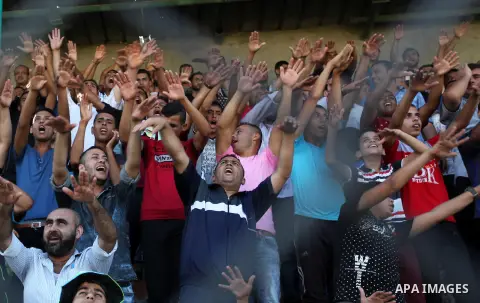 Palestinian spectators watch the first leg of the Palestine Cup final soccer match between Gaza Strip's Khan Younis Youth and Hebron's Al-Ahly at al-Yarmouk stadium in Gaza City July 26, 2016. Photo by Ashraf Amra