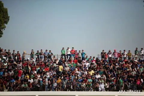 Palestinian spectators watch the first leg of the Palestine Cup final soccer match between Gaza Strip's Khan Younis Youth and Hebron's Al-Ahly at al-Yarmouk stadium in Gaza City July 26, 2016. Photo by Ashraf Amra
