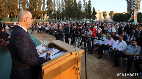 Palestinian Prime Minister Rami Hamdallah speaks during graduation ceremony at the Palestine Technical University - Kadoorie, in the West Bank city of Tulkarem, on July 28, 2016. Photo by Prime Minister Office