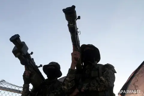 Palestinian militants from the Al-Quds Brigades, the armed wing of the Islamic Jihad movement, take part in a rally in Rafah in the southern Gaza Strip on July 28, 2016. Photo by Abed Rahim Khatib