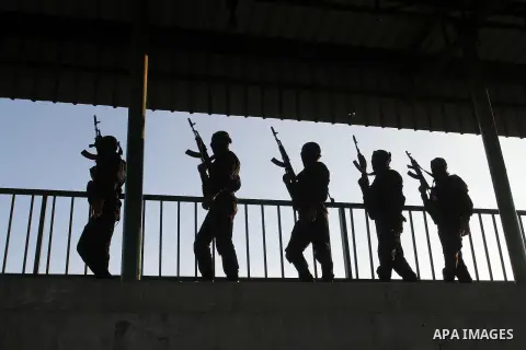 Palestinian militants from the Al-Quds Brigades, the armed wing of the Islamic Jihad movement, take part in a rally in Rafah in the southern Gaza Strip on July 28, 2016. Photo by Abed Rahim Khatib