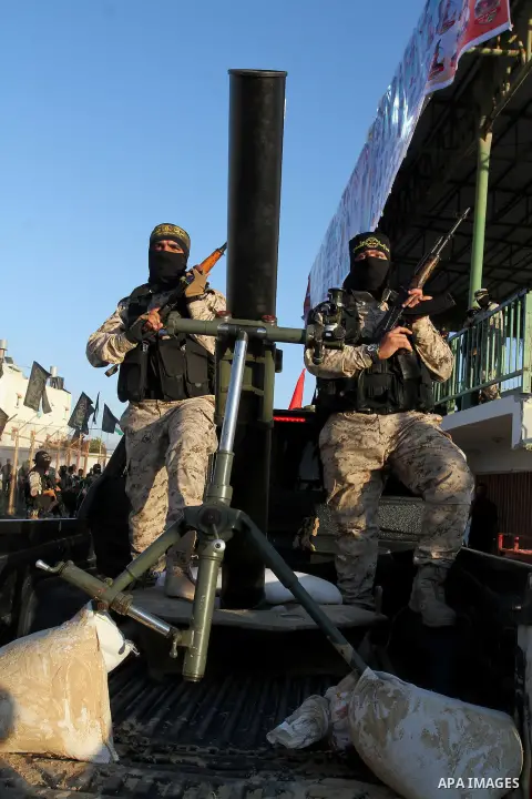 Palestinian militants from the Al-Quds Brigades, the armed wing of the Islamic Jihad movement, take part in a rally in Rafah in the southern Gaza Strip on July 28, 2016. Photo by Abed Rahim Khatib
