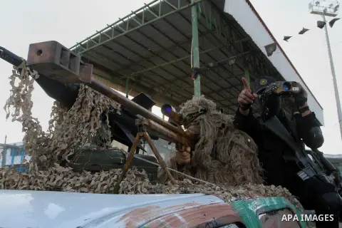 Palestinian militants from the Al-Quds Brigades, the armed wing of the Islamic Jihad movement, take part in a rally in Rafah in the southern Gaza Strip on July 28, 2016. Photo by Abed Rahim Khatib