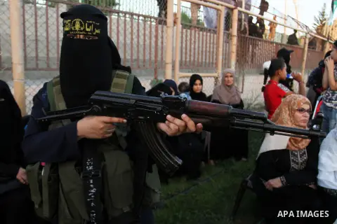 Palestinian female militants from the Al-Quds Brigades, the armed wing of the Islamic Jihad movement, take part in a rally in Rafah in the southern Gaza Strip on July 28, 2016. Photo by Abed Rahim Khatib