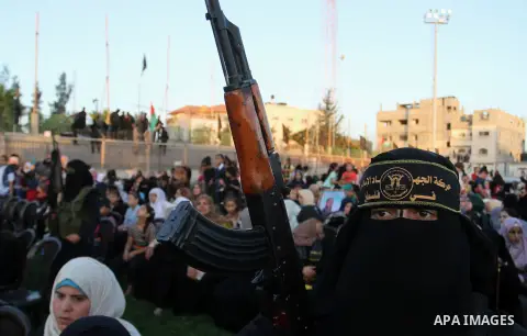 Palestinian female militants from the Al-Quds Brigades, the armed wing of the Islamic Jihad movement, take part in a rally in Rafah in the southern Gaza Strip on July 28, 2016. Photo by Abed Rahim Khatib