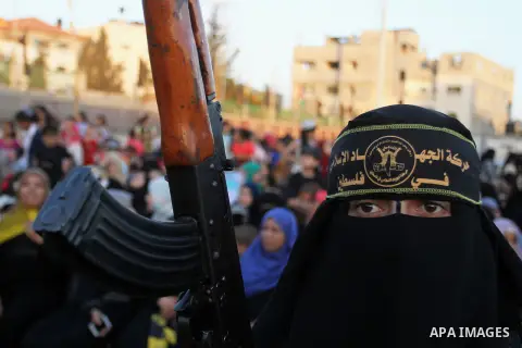Palestinian female militants from the Al-Quds Brigades, the armed wing of the Islamic Jihad movement, take part in a rally in Rafah in the southern Gaza Strip on July 28, 2016. Photo by Abed Rahim Khatib