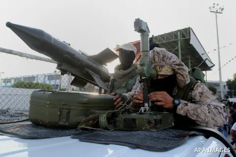 Palestinian militants from the Al-Quds Brigades, the armed wing of the Islamic Jihad movement, take part in a rally in Rafah in the southern Gaza Strip on July 28, 2016. Photo by Abed Rahim Khatib
