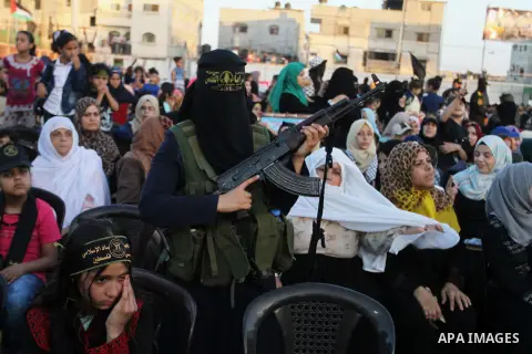 Palestinian female militants from the Al-Quds Brigades, the armed wing of the Islamic Jihad movement, take part in a rally in Rafah in the southern Gaza Strip on July 28, 2016. Photo by Abed Rahim Khatib