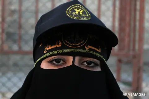 Palestinian female militants from the Al-Quds Brigades, the armed wing of the Islamic Jihad movement, take part in a rally in Rafah in the southern Gaza Strip on July 28, 2016. Photo by Abed Rahim Khatib