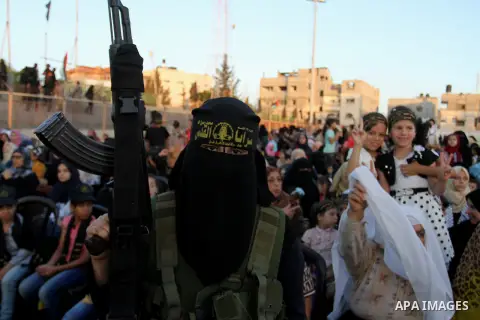 Palestinian female militants from the Al-Quds Brigades, the armed wing of the Islamic Jihad movement, take part in a rally in Rafah in the southern Gaza Strip on July 28, 2016. Photo by Abed Rahim Khatib