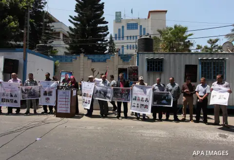 Palestinian Journalists hold banners during a protest calling for stop the Israeli violence against journalists in front of the high commissioner for human rights headquarters in Gaza City, on July 31, 2016. Photo by Ash...