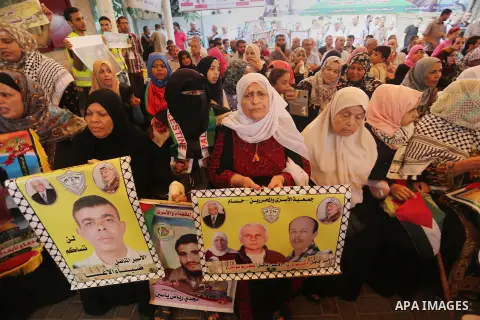 Palestinians take part in a protest demanding release the prisoners in Israeli jails, in front of Red cross office, in Gaza city on Aug. 1, 2016. Photo by Mohammed Asad