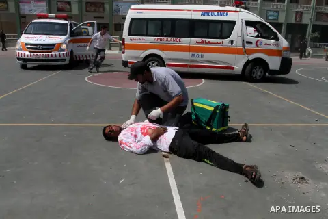 Palestinian rescue workers take part in an emergency simulation exercise in the border city of Rafah, in the southern Gaza Strip, on August 1, 2016. Photo by Abed Rahim Khatib