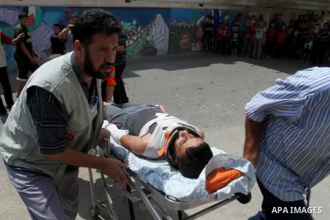 Palestinian rescue workers take part in an emergency simulation exercise in the border city of Rafah, in the southern Gaza Strip, on August 1, 2016. Photo by Abed Rahim Khatib
