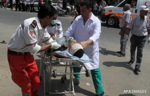 Palestinian rescue workers take part in an emergency simulation exercise in the border city of Rafah, in the southern Gaza Strip, on August 1, 2016. Photo by Abed Rahim Khatib