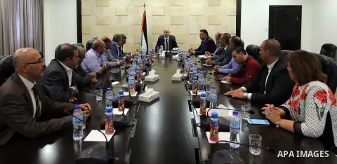 Palestinian Prime Minister Rami Hamdallah meets with Jeremy Dear Deputy General Secretary of International Federation of Journalists (IFJ), in the West Bank city of Ramallah, on Aug. 01, 2016. Photo by Prime Minister Off...