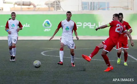 Ahly al-Khalil players and Shabab Khan Yunis players compete during thier a second leg match for the Palestinian Cup final on August 2, 2016 at Hussein Bin Ali Stadium in the West Bank city of Hebron. The match had origi...