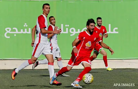 Ahly al-Khalil players and Shabab Khan Yunis players compete during thier a second leg match for the Palestinian Cup final on August 2, 2016 at Hussein Bin Ali Stadium in the West Bank city of Hebron. The match had origi...
