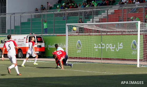 Ahly al-Khalil players and Shabab Khan Yunis players compete during thier a second leg match for the Palestinian Cup final on August 2, 2016 at Hussein Bin Ali Stadium in the West Bank city of Hebron. The match had origi...