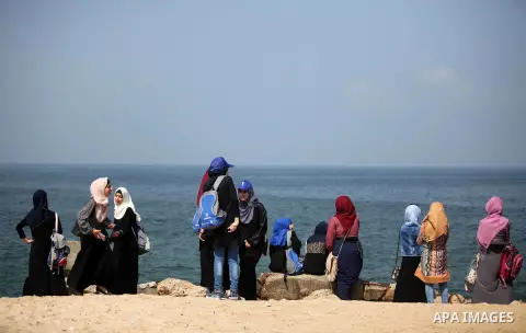 Palestinian girls take part in a protest to mark the second anniversary of the 50-day Israeli war on Gaza Strip last summer, in Gaza seaport Aug. 03, 2016. July 8th marks the two-year anniversary of the war between Israe...