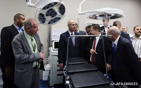 Palestinian Prime Minister Rami Hamdallah attends the opening ceremony of the new wing operations of Alia governmental hospital, in the West Bank city of Hebron, on Aug. 03, 2016. Photo by Prime Minister Office