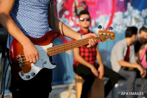 Palestinian band Dawaween, who were denied access to perform at a festival in Jerusalem, deliver a performance as part of a protest against the denial in Beit Hanun, near the Erez crossing point with Israel, in the north...