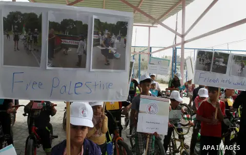Palestinian children take part in the bicycles marathon to demand their right to play and break the siege on Gaza strip, in Rafah in the southern Gaza Strip. on August 7, 2016. Photo by Abed Rahim Khatib