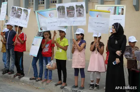 Palestinian children take part in the bicycles marathon to demand their right to play and break the siege on Gaza strip, in Rafah in the southern Gaza Strip. on August 7, 2016. Photo by Abed Rahim Khatib