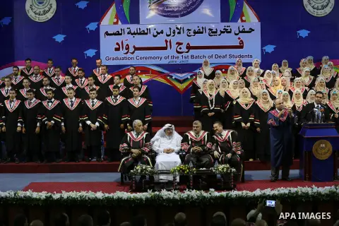 Palestinian deaf students participate in their first graduation ceremony at the Islamic University in Gaza city on August 7, 2016. Photo by Mohammed Asad