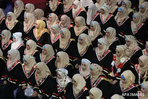 Palestinian deaf students participate in their first graduation ceremony at the Islamic University in Gaza city on August 7, 2016. Photo by Mohammed Asad