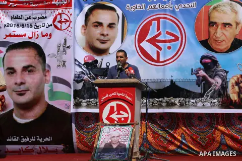 Supporters of the Popular Front for the Liberation of Palestine (PFLP) take part in a protest demanding for the release of Bilal Kayed a Palestinian prisoner on hunger strike, in front of Red cross office, in Gaza city o...