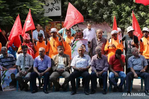 Supporters of the Popular Front for the Liberation of Palestine (PFLP) take part in a protest demanding for the release of Bilal Kayed a Palestinian prisoner on hunger strike, in front of Red cross office, in Gaza city o...