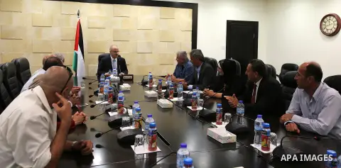 Palestinian Prime Minister, Rami Hamadallah,meets with Fatah members in Jenin province, in the West Bank city of Ramallah, on Aug 8, 2016. Photo by Prime Minister Office