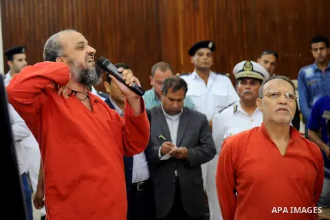 An Egyptian Muslim Brotherhood defendant speaks to judges during his trial in a case known in media as "Rabaa Operations Room", in Cairo, on Aug. 09, 2016. Photo by Amr Sayed