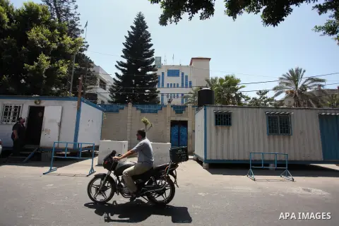 A Palestinian man rides a motorcycle in front of its headquarters in Gaza City on August 10, 2016. Israel said it had arrested and charged a United Nations employee for allegedly aiding Islamist movement Hamas, in the se...