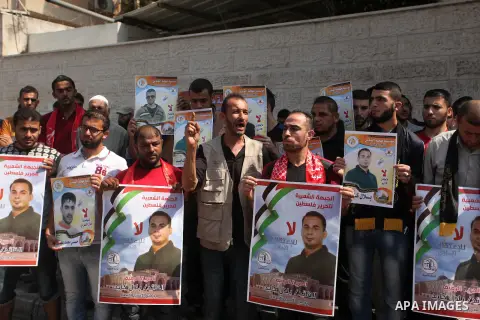 Palestinians take part in a protest demanding for the release prisoners on hunger strike in Israeli jails, in front of Red cross office, in Gaza city on Aug. 11, 2016. Photo by Ashraf Amra